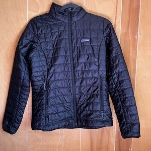 Patagonia Women’s puff jacket. S in size. Black in color. Ketel One embroidery